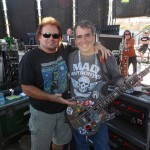 Michael Anthony and Eduardo Pinheiro on stage.